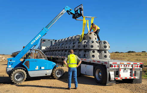 Delivery of reef balls on a truck bed, to create fish habitat for Lake Ralph Hall.